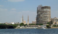 Al Gamma bridge, Salah El-Deen Mosque and apartment block from a floating KFC restaurant on the Nile