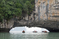 Tourists being (upright) rowed around an island