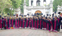 Graduates throwing mortar-boards