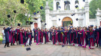 Graduates throwing mortar-boards