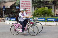 Cyclists with “young pioneer” neckbands