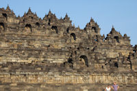 Buddhas in their enclaves on the east side of Borobudur