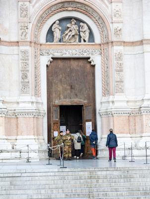 Armed guards at the entrance to Basilica di San Petronio because of a controversial painting