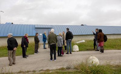 Tour group outside the Western arm building