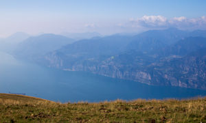 Paragliding with western side of Lake Garda in background