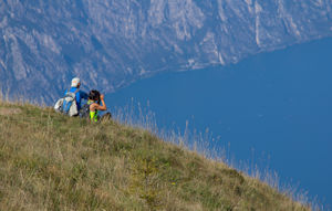 Visitors to Monte Baldo with the north-western coast of Lake Garda