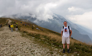 Tourist and clouds covering the mountain to the south