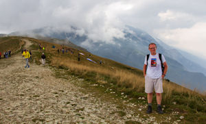 Tourist and clouds covering the mountain to the south