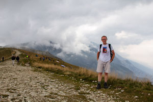 Tourist and clouds covering the mountain to the south