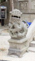 Traditional male & female lions guarding the A-Ma temple