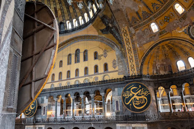Behind one of the wooden plaques with sacred Islamic names
