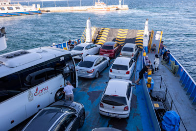 Vehicles, including the tour bus and driver Amir, on the ferry